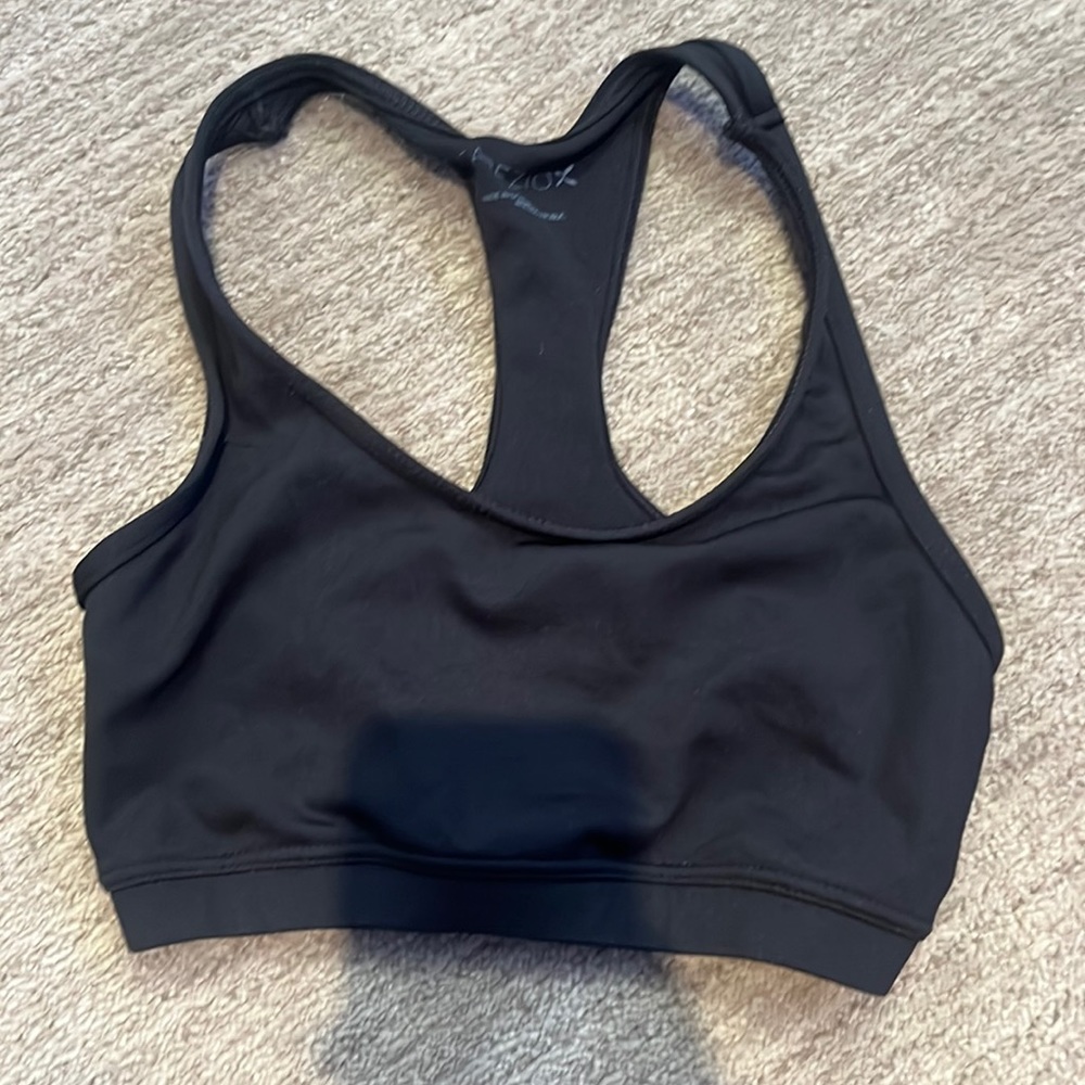 Super comfortable and supportive sports bra. Brand is Capezio. Colour is black